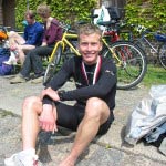 Hans after the end of the race with the completion medal around his neck