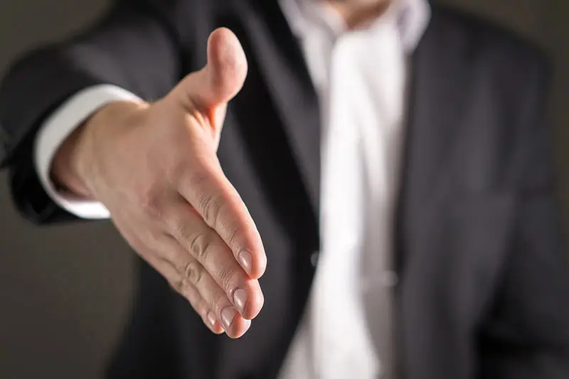 Businessman offering to shake hands