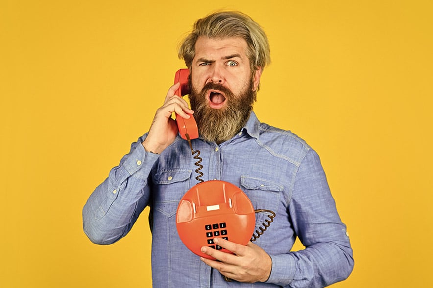 man call by old red phone