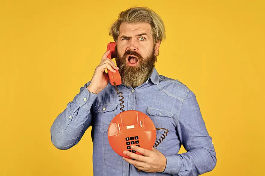 man call by old red phone