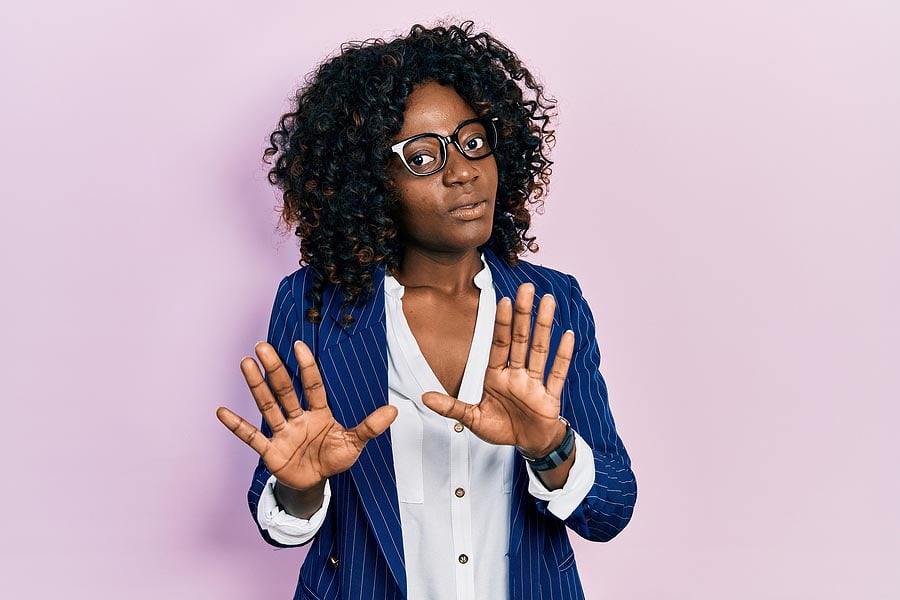 Young african american woman wearing business clothes and glasse