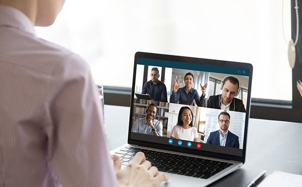 Computer screen view during group video call with multiethnic colleagues