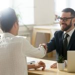 Smiling lawyer, realtor or financial advisor handshaking young couple thanking for advice, insurance broker or bank worker and millennial customers shake hands making deal, investment or taking loan