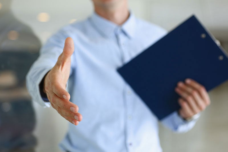 Businessman holding out hand