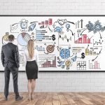 Business people with business map