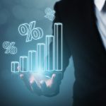 Businessman with digital percent graph