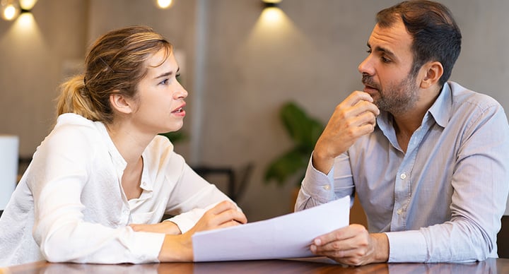 Two business people having a consultative selling meeting