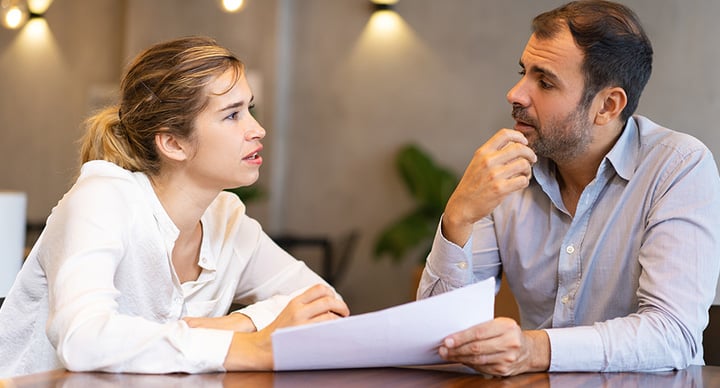 Sales trainer working with delegates on a task