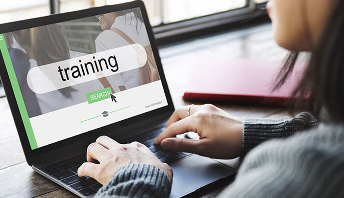 Sales person on a laptop taking an online sales course