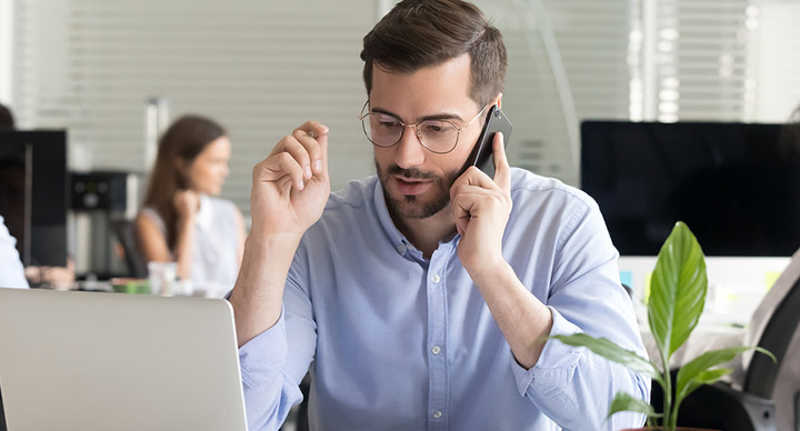 Sales manager on the telephone making calls