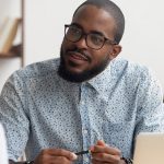 African hr manager listening to caucasian applicant at job interview