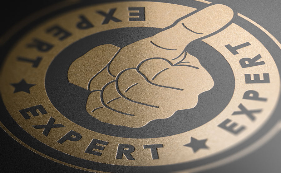 Golden Stamp With The Word Expert And A Hand With Thumb Up Over