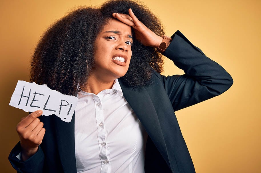 black woman with help sign