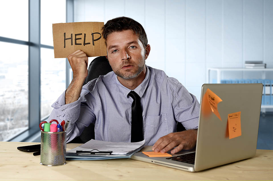 sad man with help sign