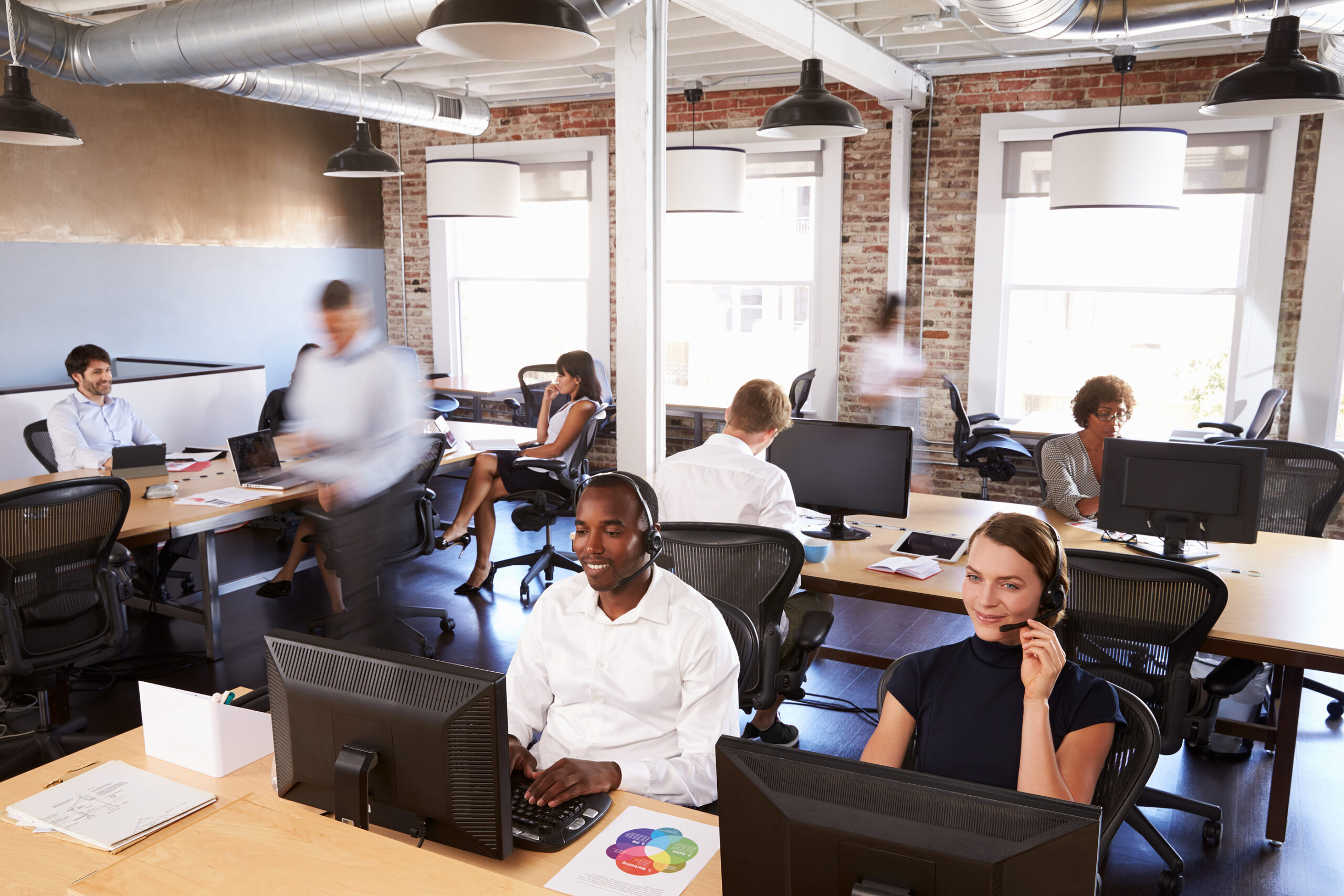 Busy-telesales-team-working-in-an-open-plan-office-scaled